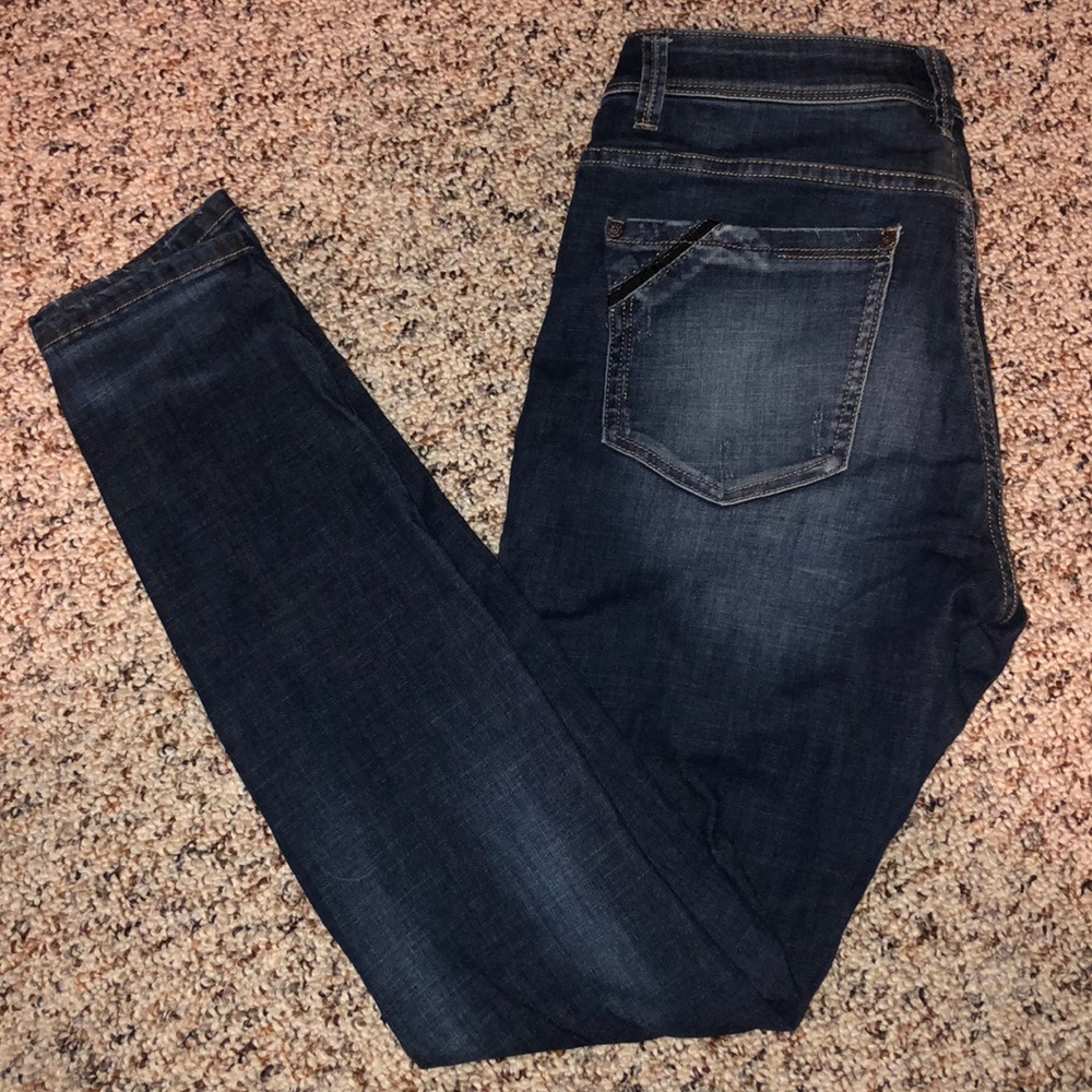Buckle black skinny jeans
